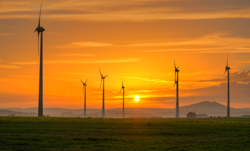 Wind turbines across a renewable energy landscape